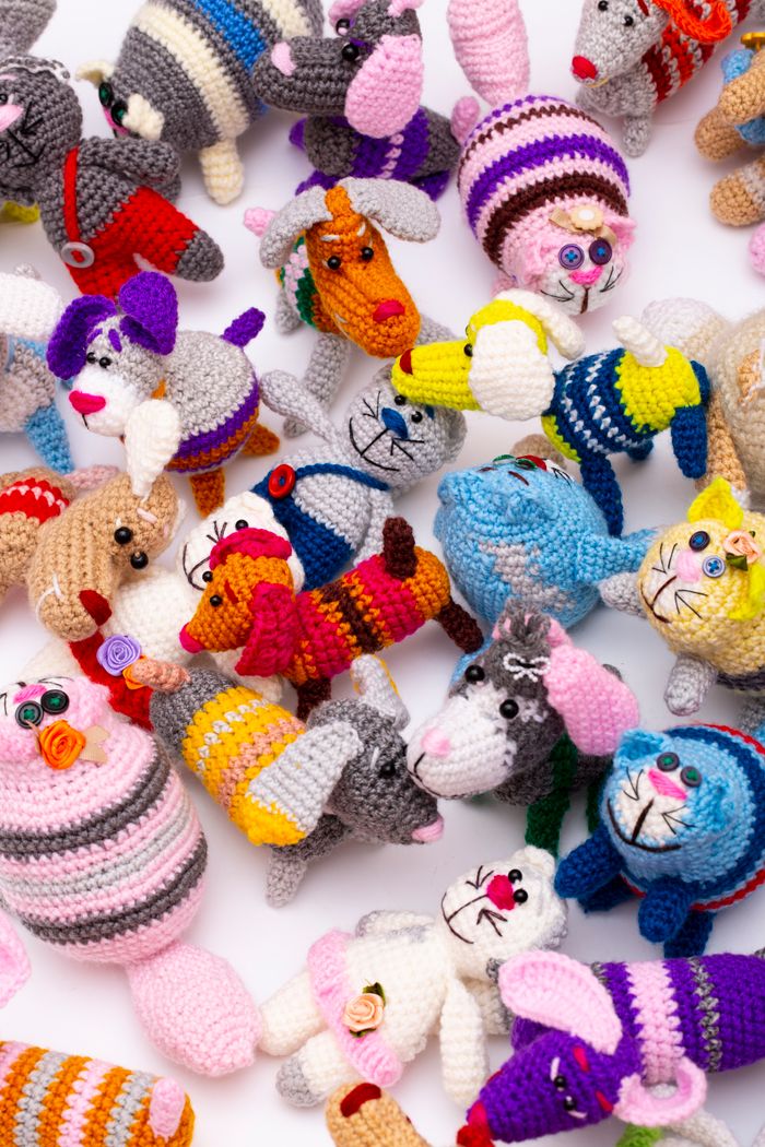about-us A vibrant collection of crocheted animal toys in various colors and designs, perfect for children.